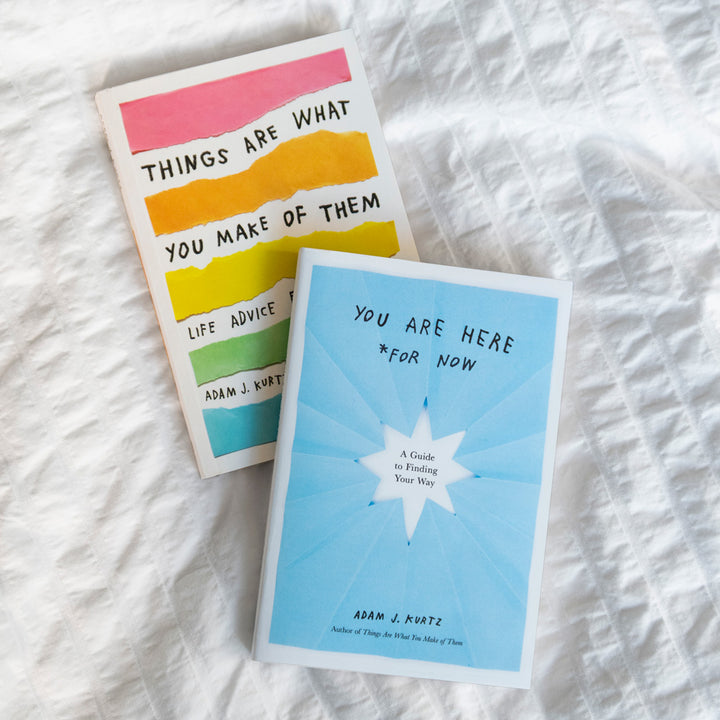 Two books by Adam J. Kurtz, You Are Here For Now and Things Are What You Make of Them photographed on a white blanket